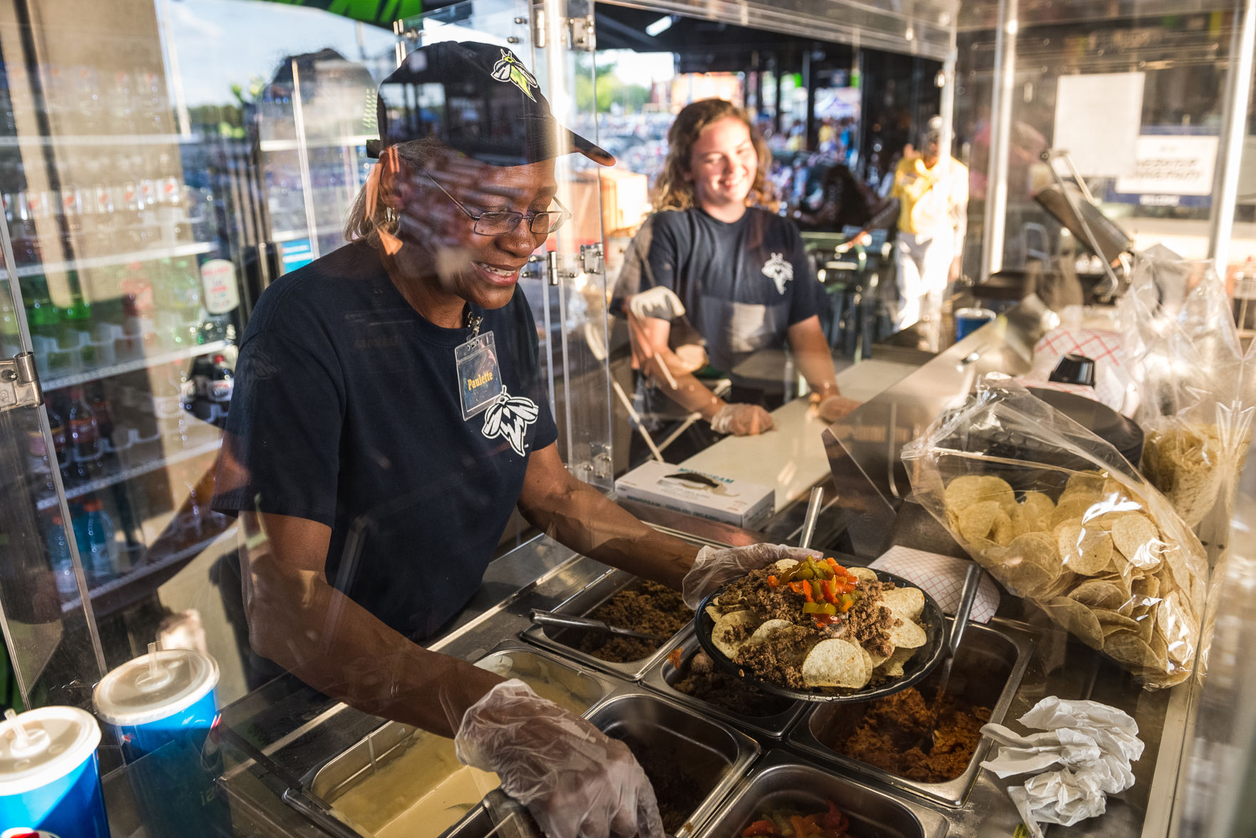Paulette Johnson-Davis makes a plate of nachos Columbia Fireflies